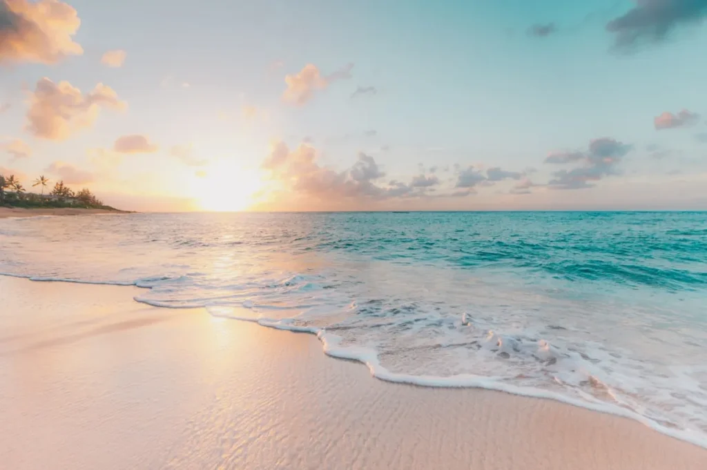 Crystal clear ocean and white sand beach at Turtle Island Bali tour packages